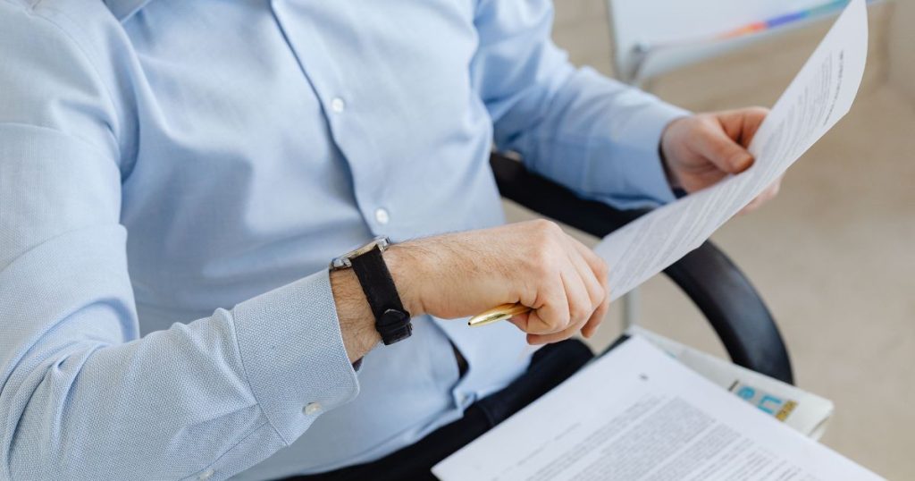 Business owner reviewing business loan requirements documents before applying for financing